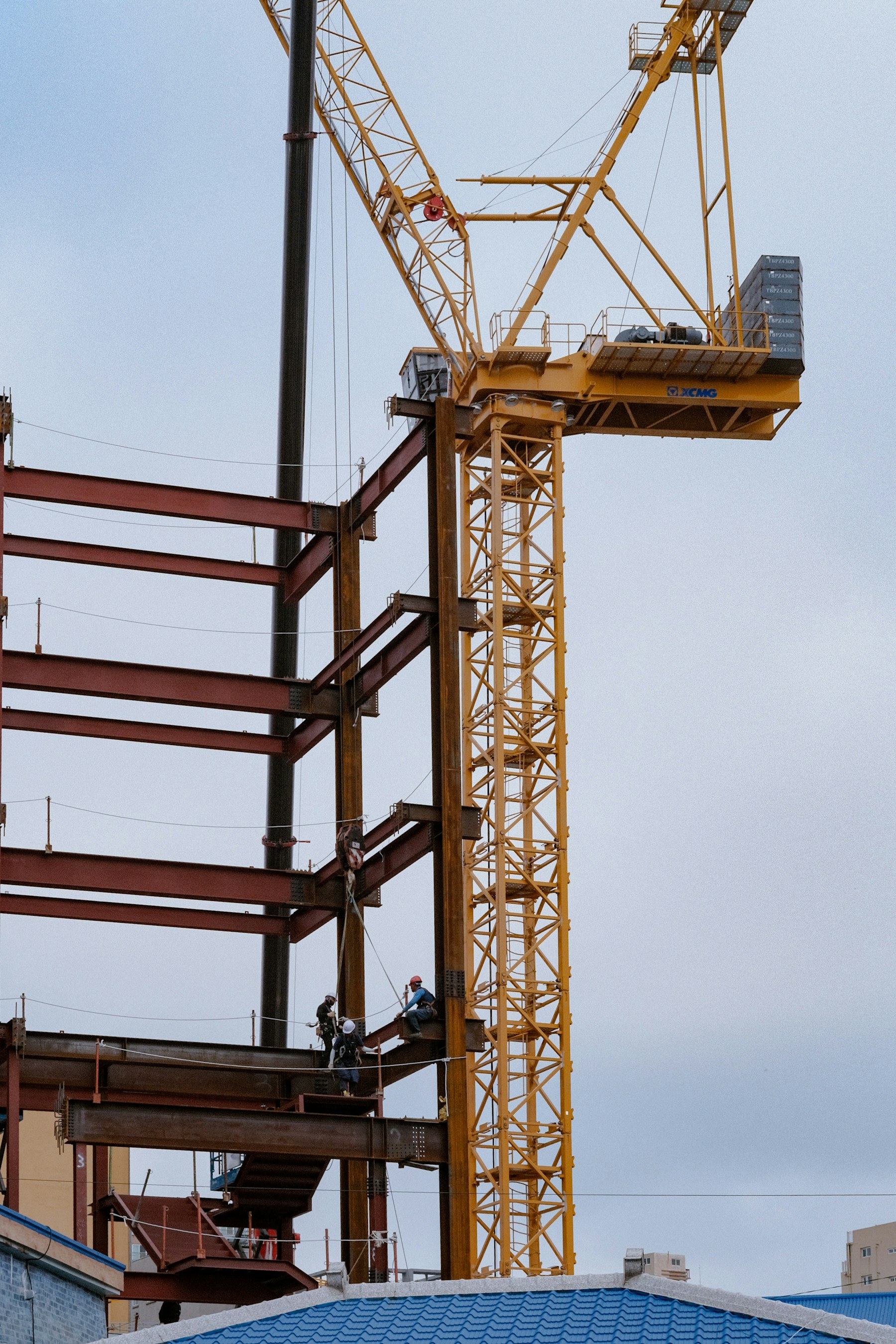 Workers on a steel construction frame